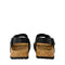 Black sandals with cork soles on a white background