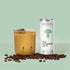 Mynd Iced Mushroom Latte poured into a glass with coffee beans