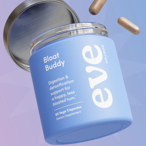 Image of bottle of bloat buddy open with the lid off and some caps floating above it