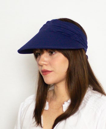 Image of lady wearing the Calypso sun visor in Navy