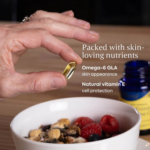 Hand holding a supplement capsule over a bowl of fruit and granola, with text about nutrients.