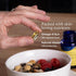 Hand holding a supplement capsule over a bowl of fruit and granola, with text about nutrients.