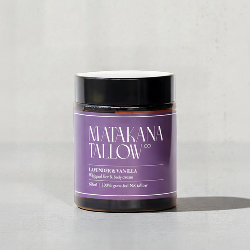 Jar of Matakana Tallow cream with purple label on a light gray background