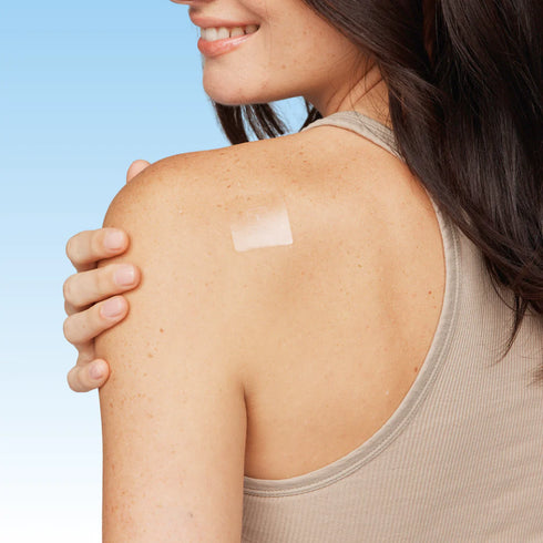 Image of a patch placed on a women's upper back