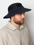 Male model wearing the Cruiser hat in Navy