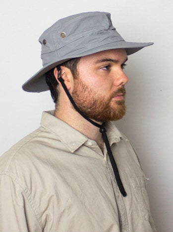 male model wearing the outrigger hat in grey