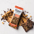Image of Raw Protein Bar - Peanut Butter and chocolate in the background