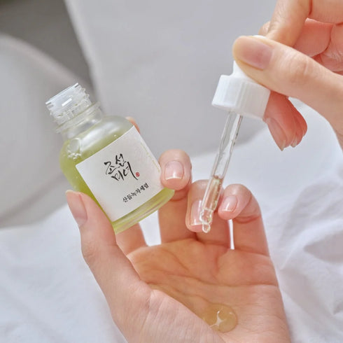 Image of Calming Serum: Green Tea + Panthenol dropped into hand