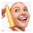 Image of woman holding HISMILE Toothpaste Mango Sorbet 60g