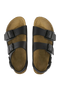 Pair of brown sandals with black straps on a white background