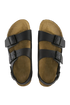 Pair of brown sandals with black straps on a white background