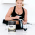Image of RawFIT Perform & Recover Protein - Vanilla being made into smoothie by woman