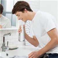 Image of man using Waterpik Cordless Water Flosser White