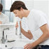 Image of man using Waterpik Cordless Water Flosser White