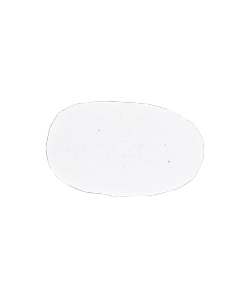 Clear circular drop of toner on a white background