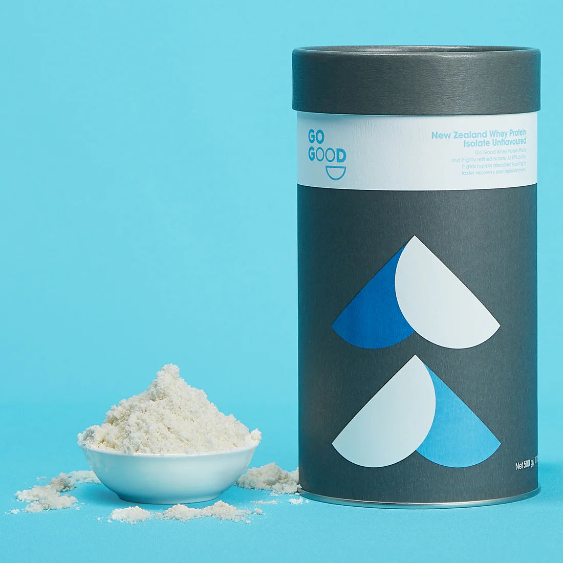 Go Good Unflavoured Whey Protein Isolate 1kg tube beside a bowl of the unflavoured powder on a blue background