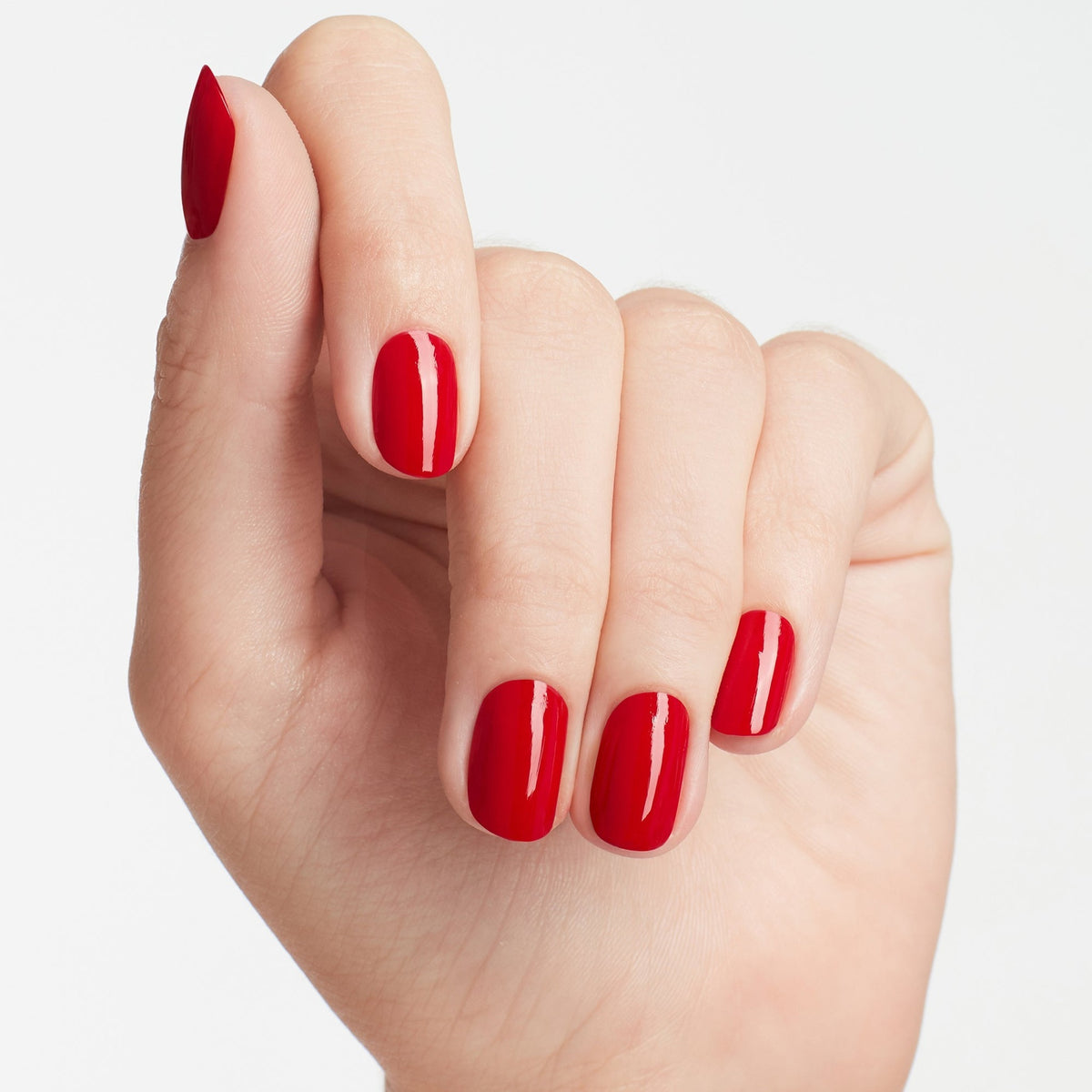 A manicure painted in OPI Big Apple Red