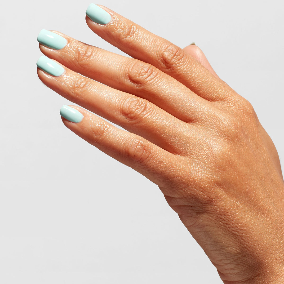 A manicure painted in OPI OPI Top Coat