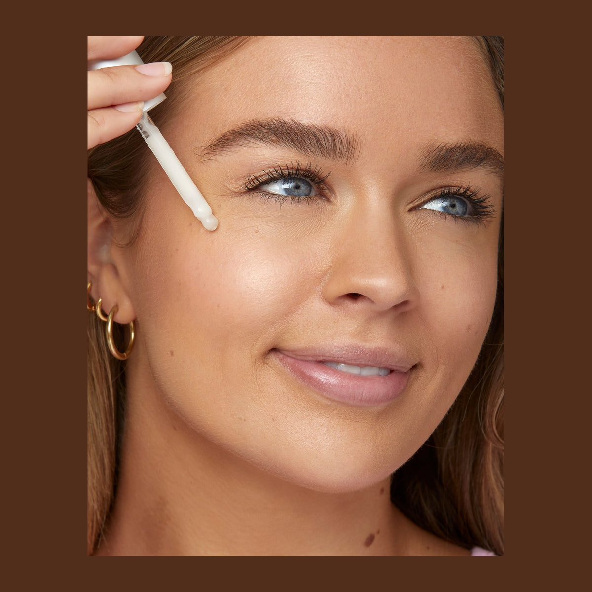 Natio Rosewater Antioxidant Serum 30ml shown in use