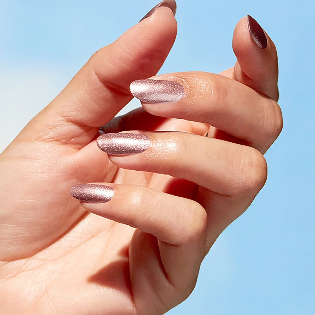 A manicure painted in OPI Intentions are Rose Gold