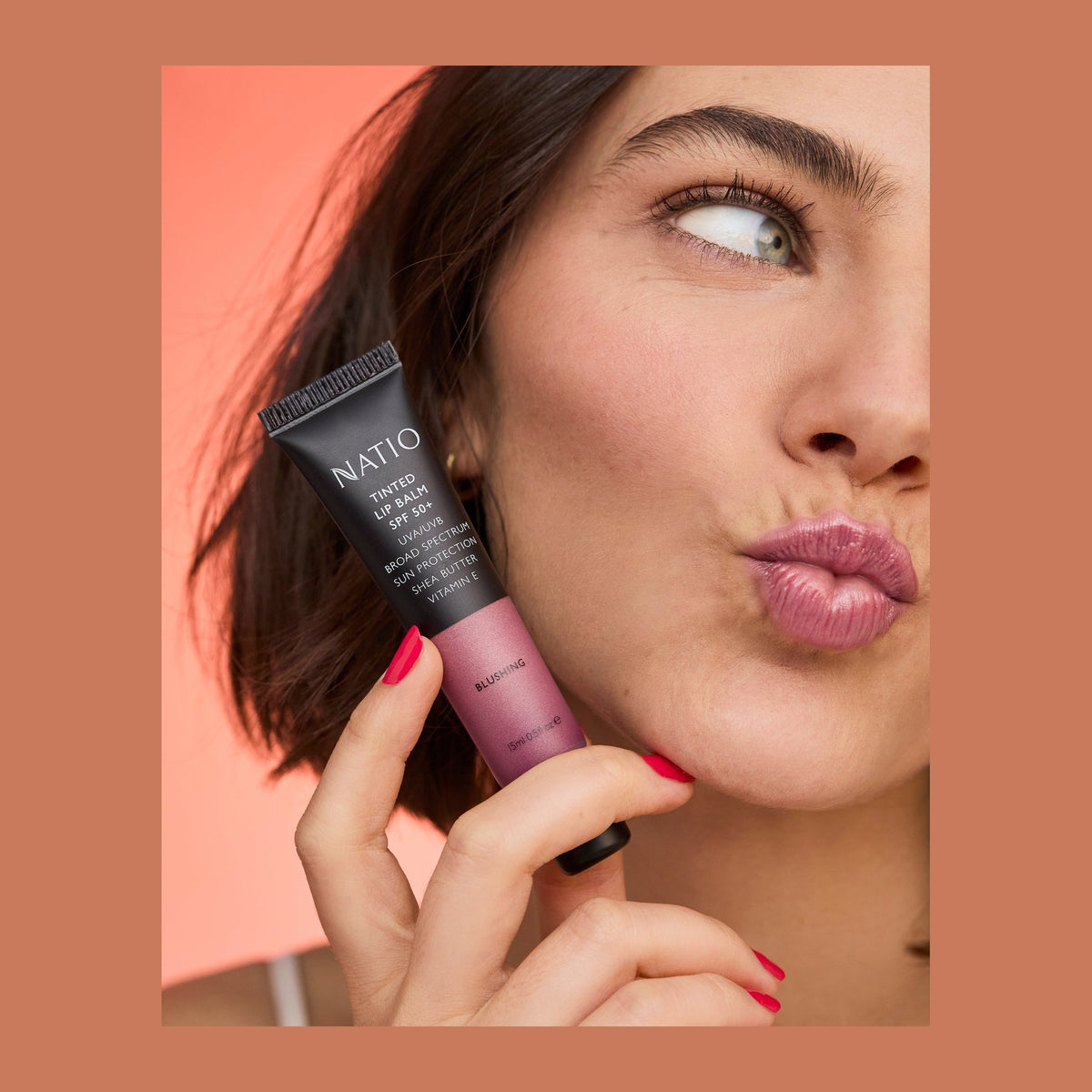 Natio Tinted Lip Balm SPF50+ Blush 15ml shown in use