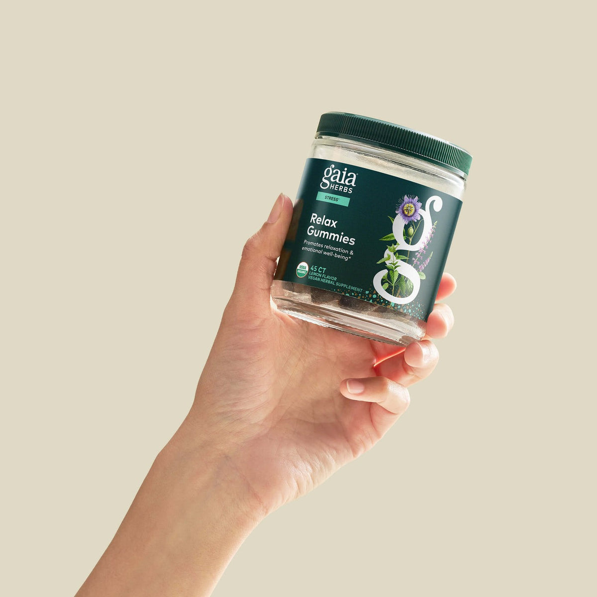 Gaia Herbs Relax Gummies held in hand