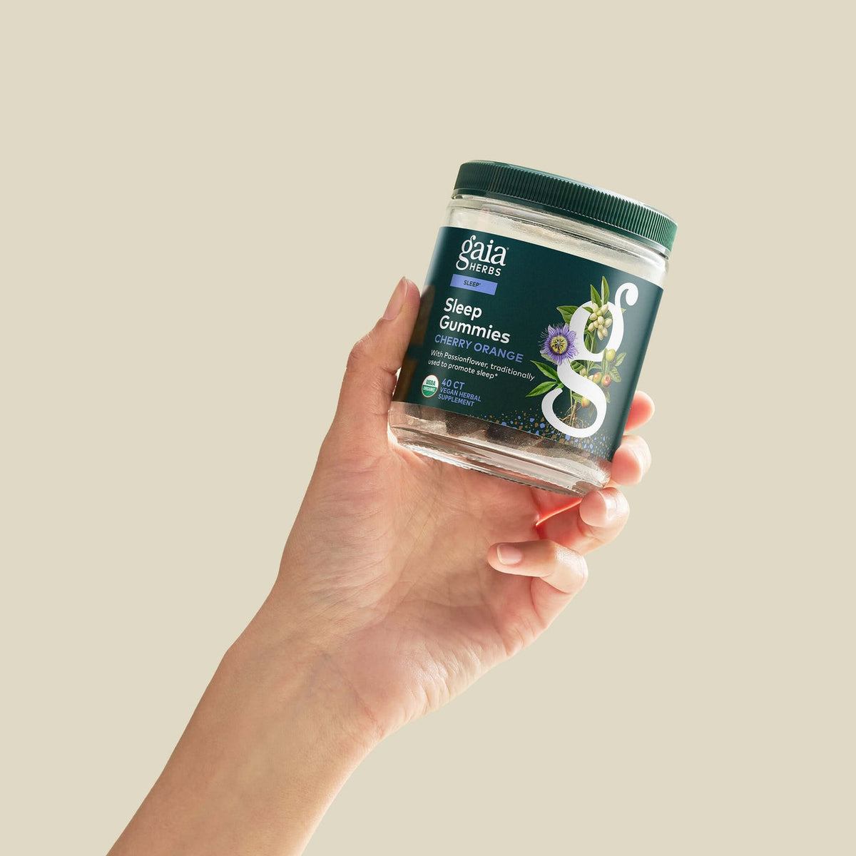 Gaia Herbs Sleep Gummies held in hand