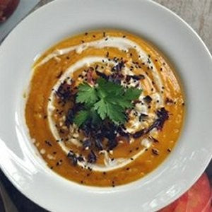 A bowl of soup garnished with dulse
