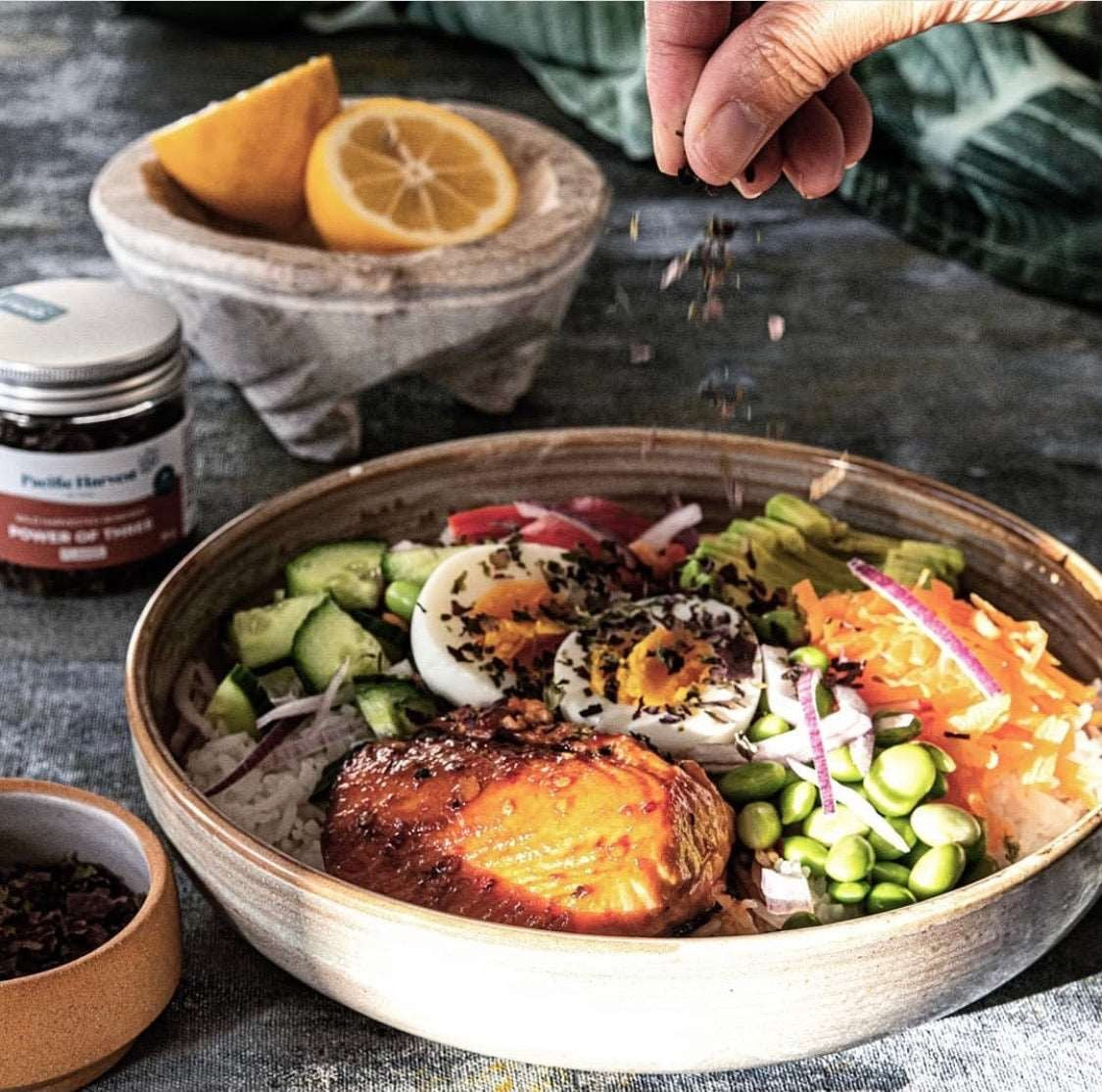 A salmon bowl finished with Power of Three flakes