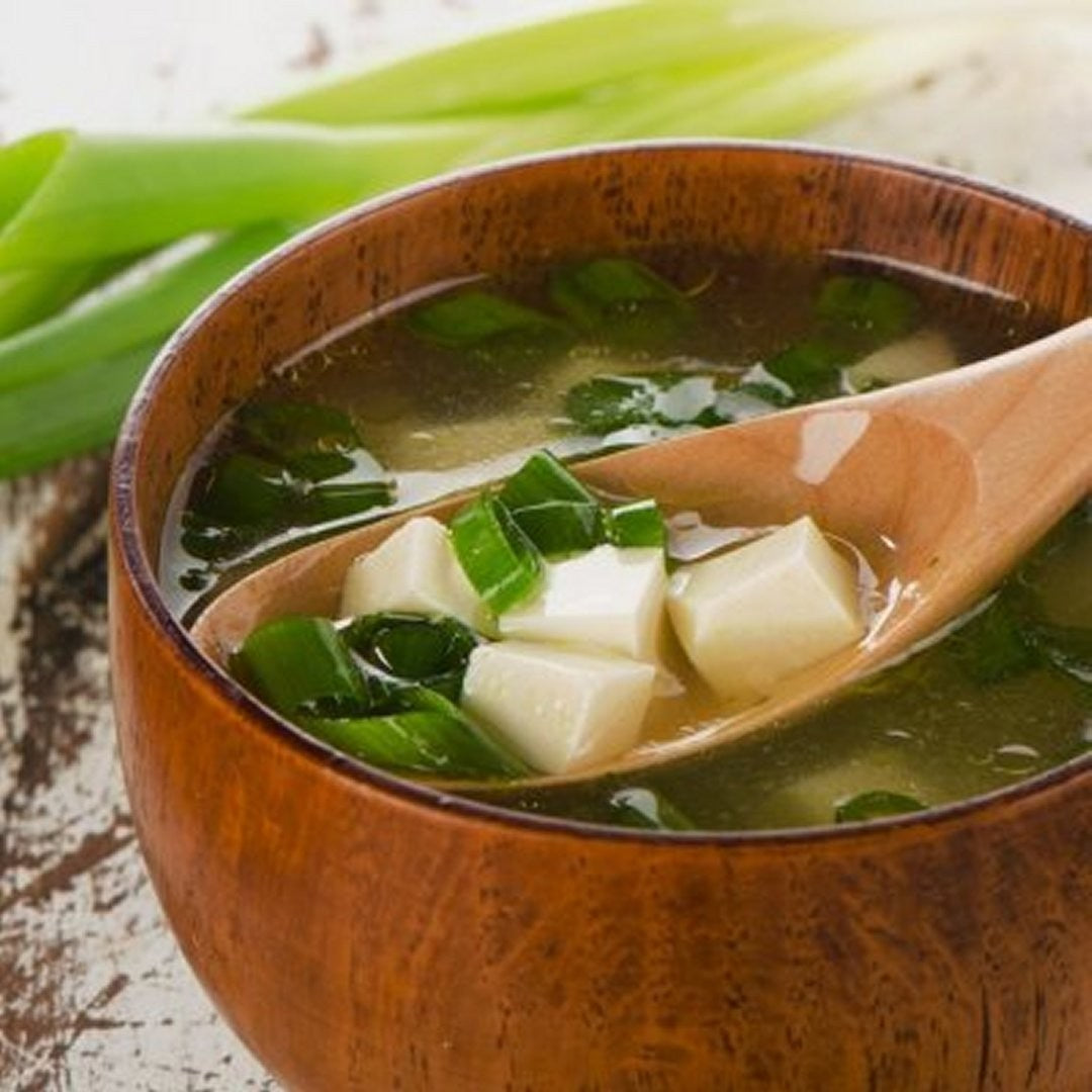 A bowl of miso soup with wakame