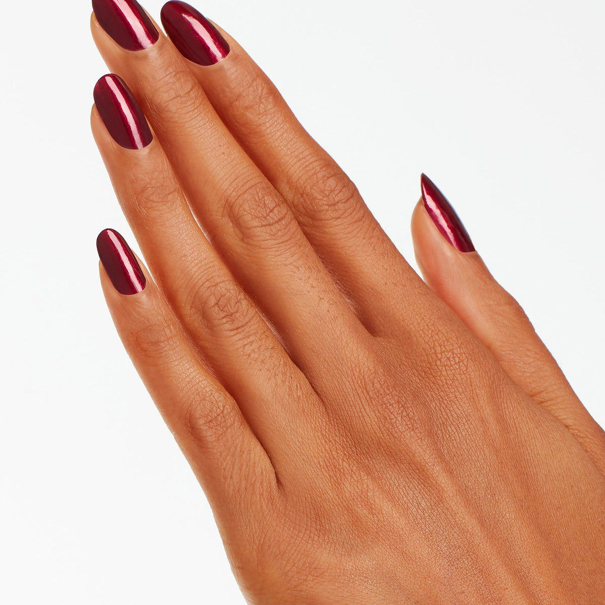 A manicure painted in OPI Bogotá Blackberry