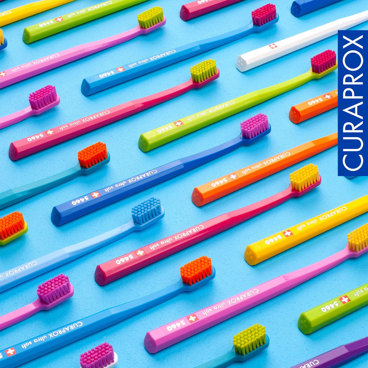 Curaprox CS 5460 toothbrushes laid out in the assorted colour range