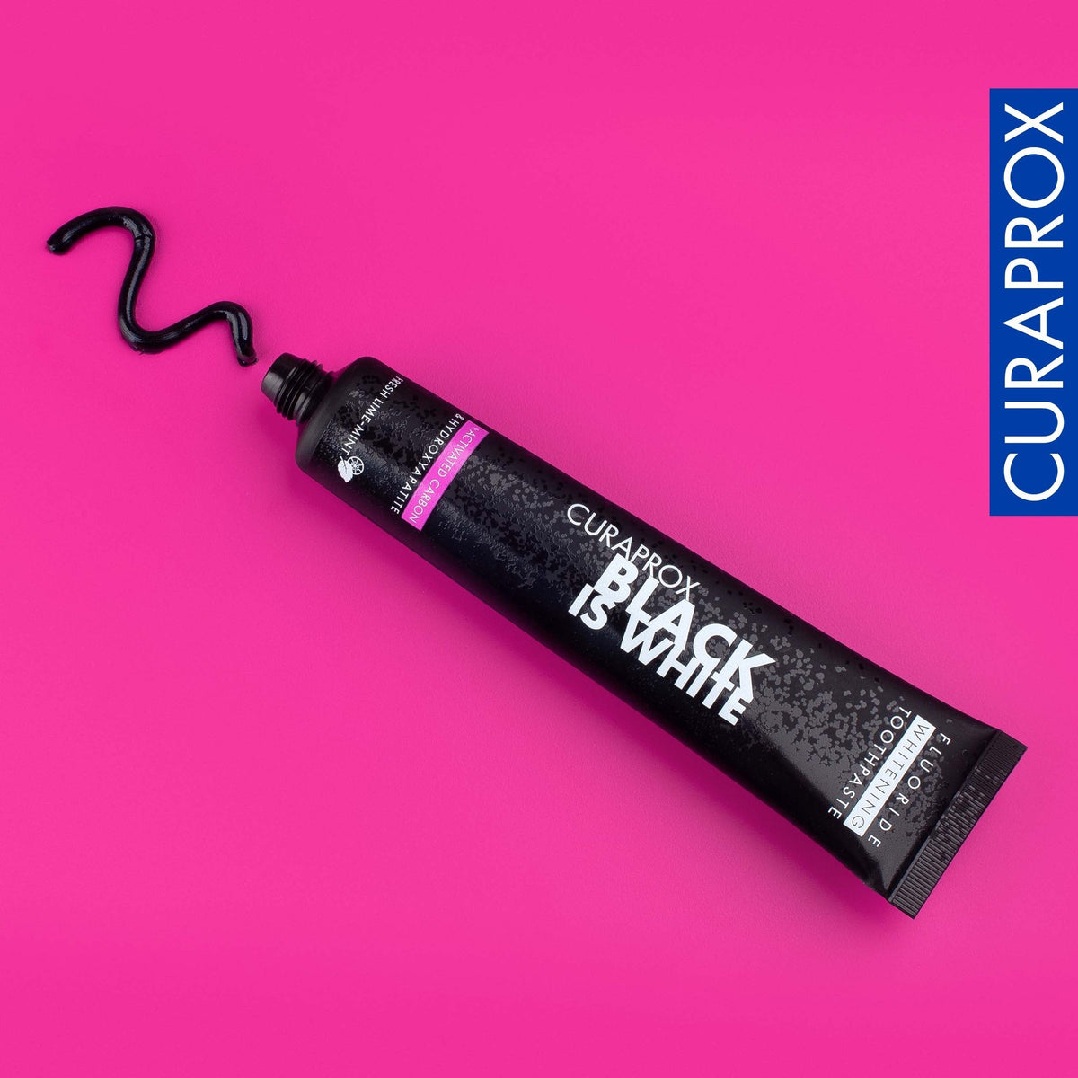 Curaprox Black is white toothpaste tube with a black paste swirl