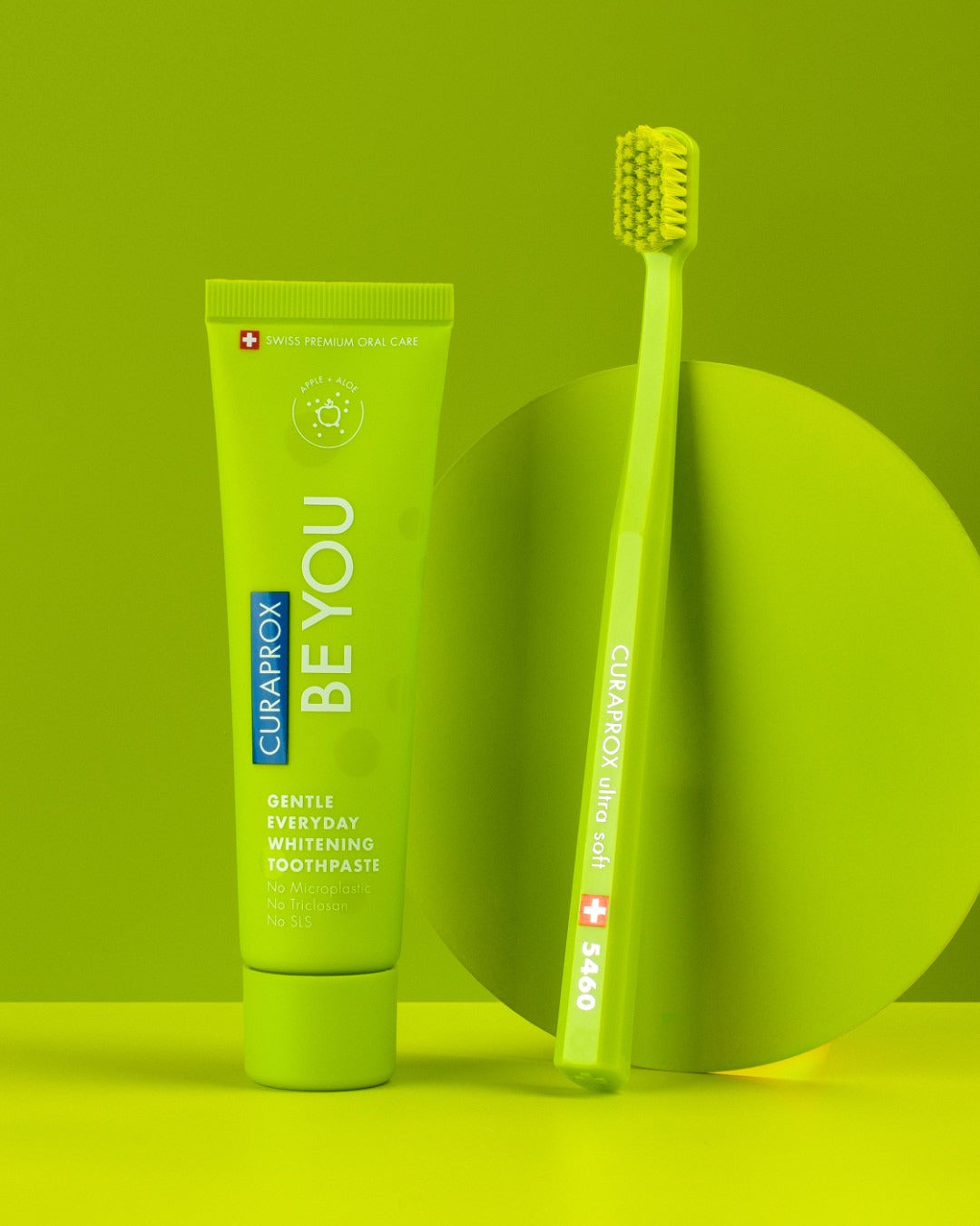 Curaprox Be you Apple and Aloe tube with a matching green toothbrush