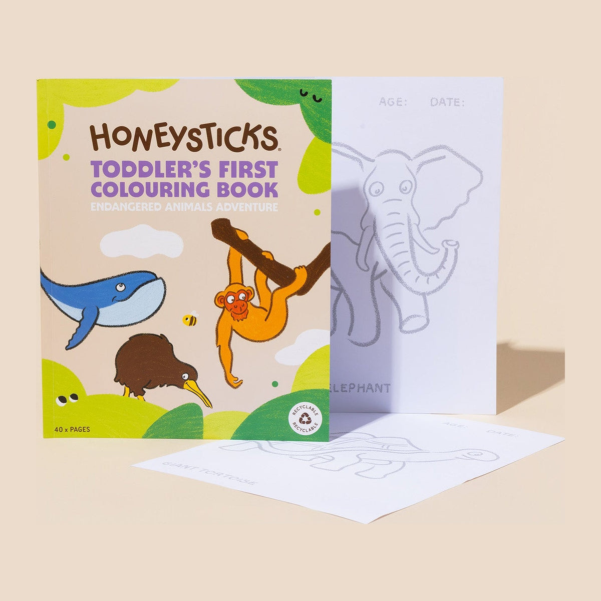 The colouring book cover with a torn-out elephant page beside it