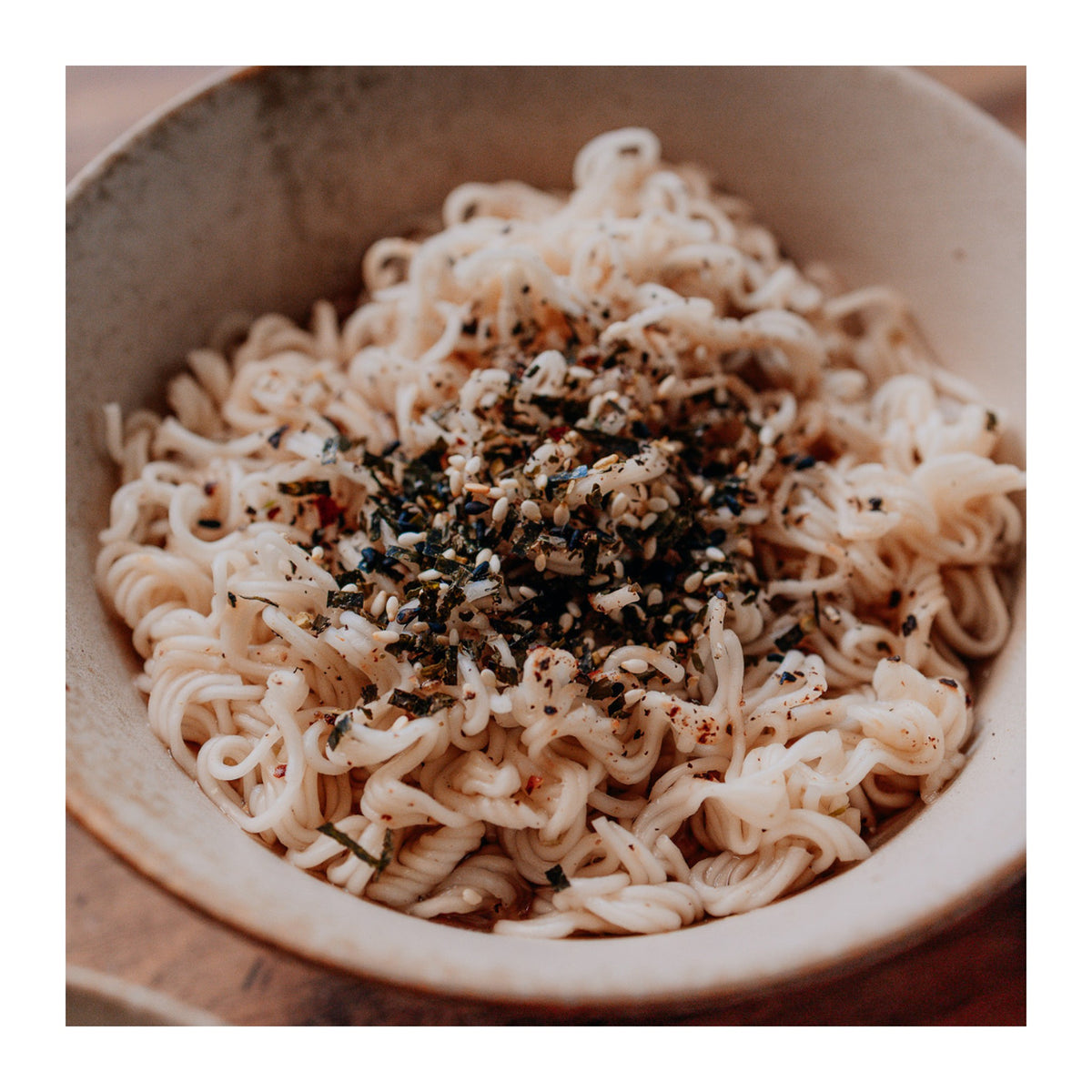 Ceres Organics instant noodles prepared in a bowl with black pepper and sesame