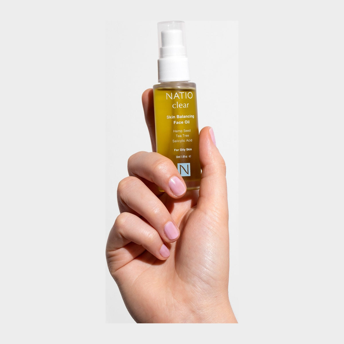 Natio Clear Skin Balancing Face Oil 30ml shown in use
