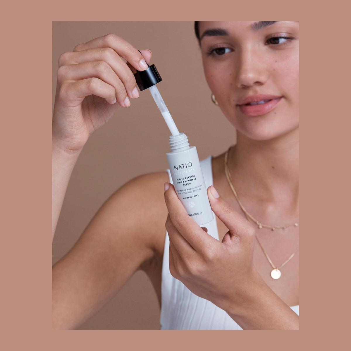 Natio Treatments Vitamin C Skin Brightening Serum 30ml shown in use