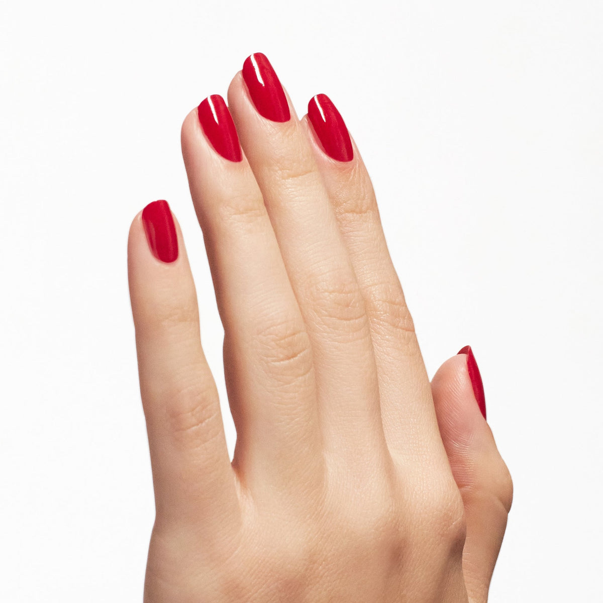 A manicure painted in OPI Nail Envy Big Apple Red