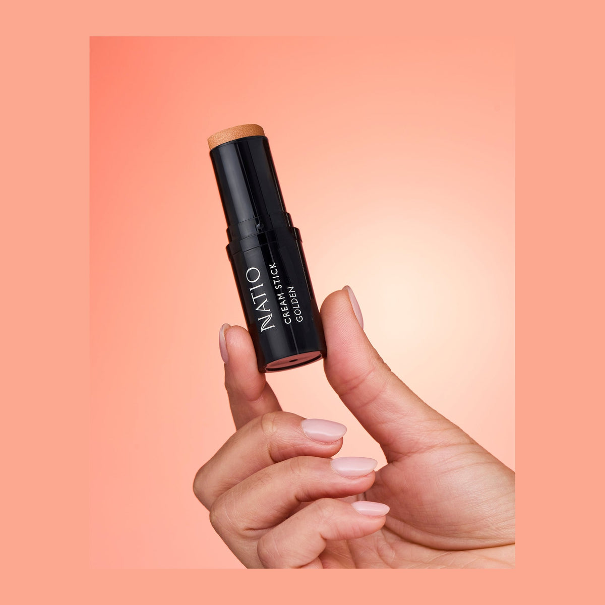 Natio Cream Stick Highlighter Golden 7.5g shown in use