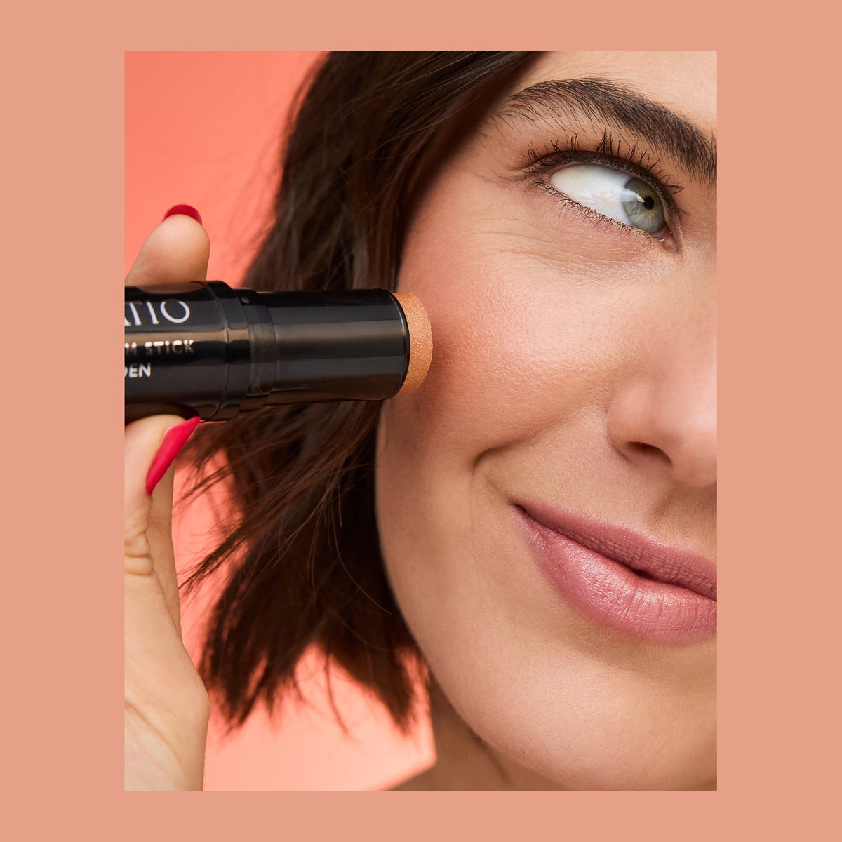 Natio Cream Stick Highlighter Golden 7.5g shown in use