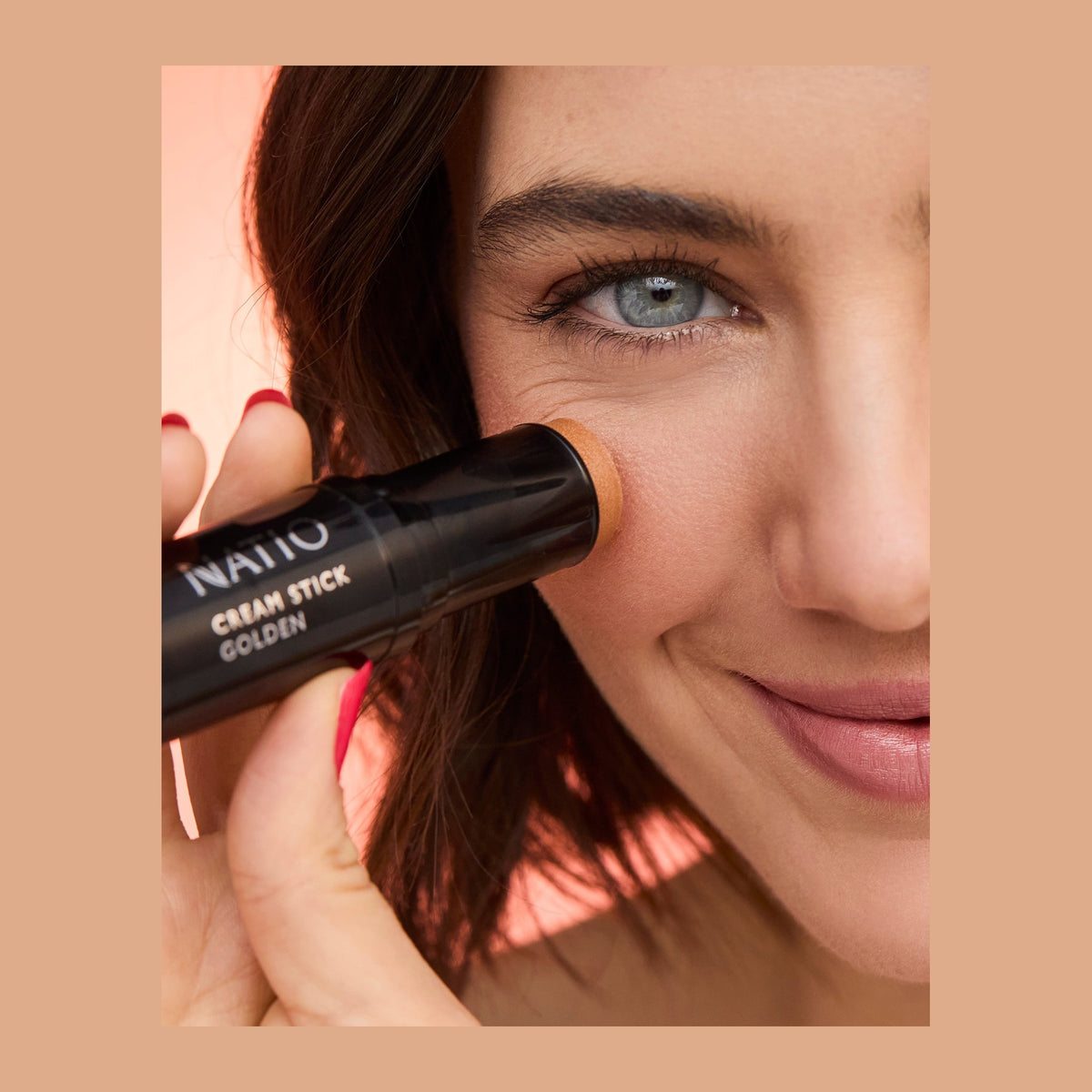 Natio Cream Stick Highlighter Golden 7.5g shown in use