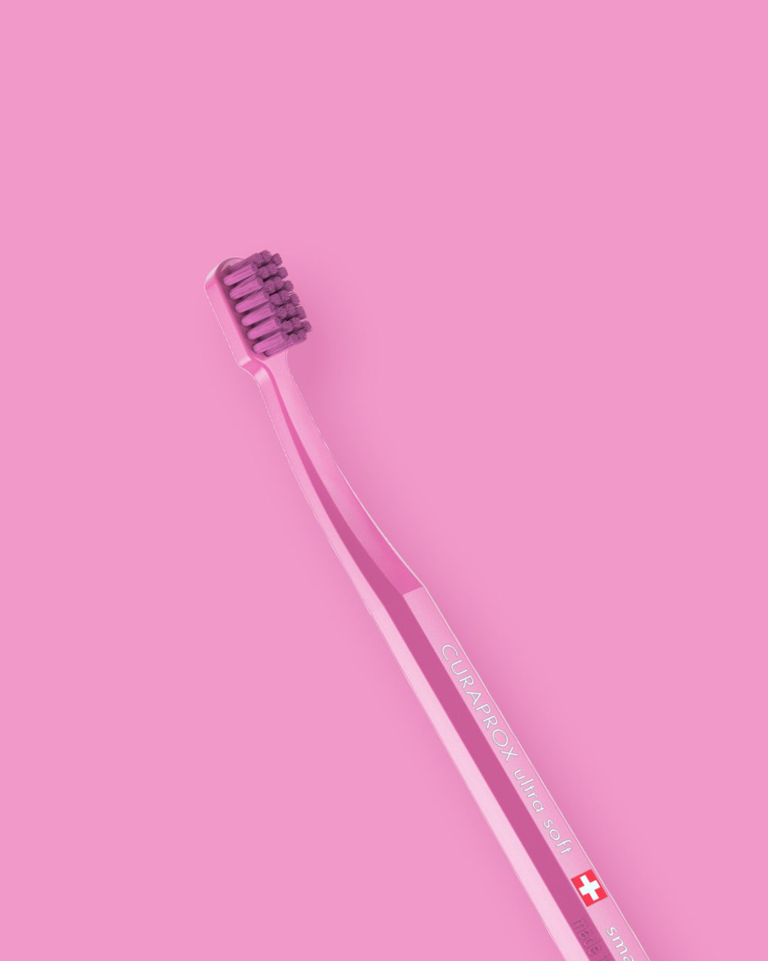 Curaprox CS smart toothbrush showing the small brush head