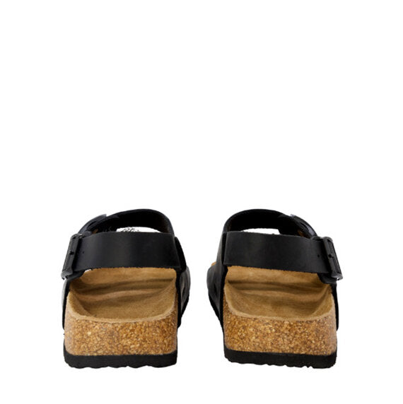 Black sandals with cork soles on a white background