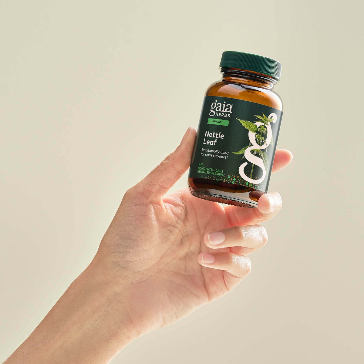 Gaia Herbs Nettle Leaf held in hand