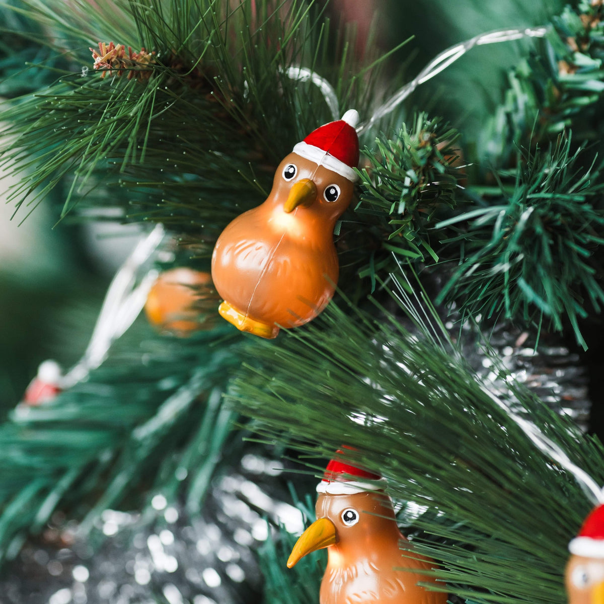 Kiwi Santa lights hung on a Christmas tree