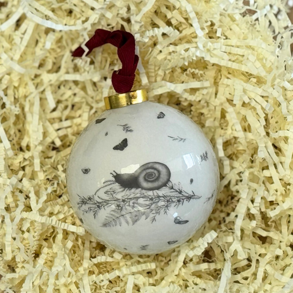 The reverse of the kiwi bauble, showing the native insects in the design