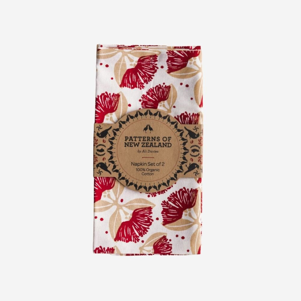 Ali Davies pohutukawa napkins in red, folded in their paper band