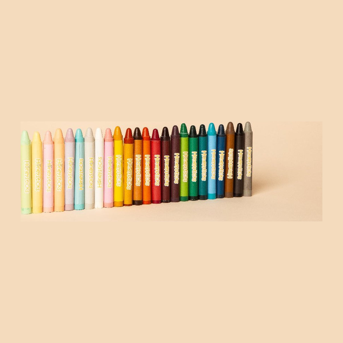The 24 jumbo beeswax crayons lined up in colour order