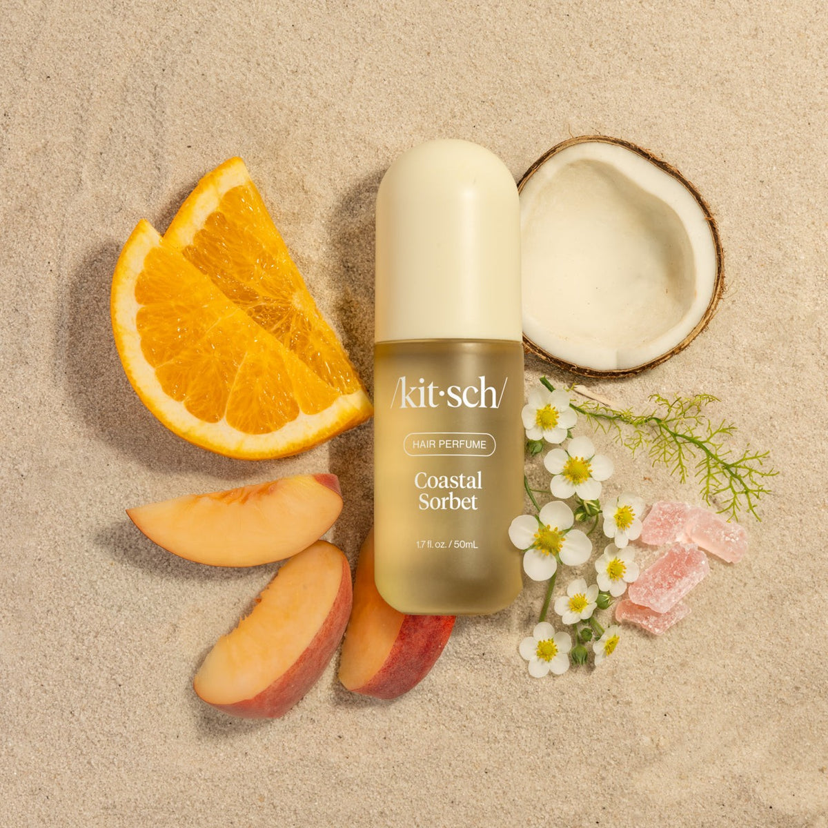 Coastal Sorbet scent ingredients laid out: orange, mango, peach and coconut